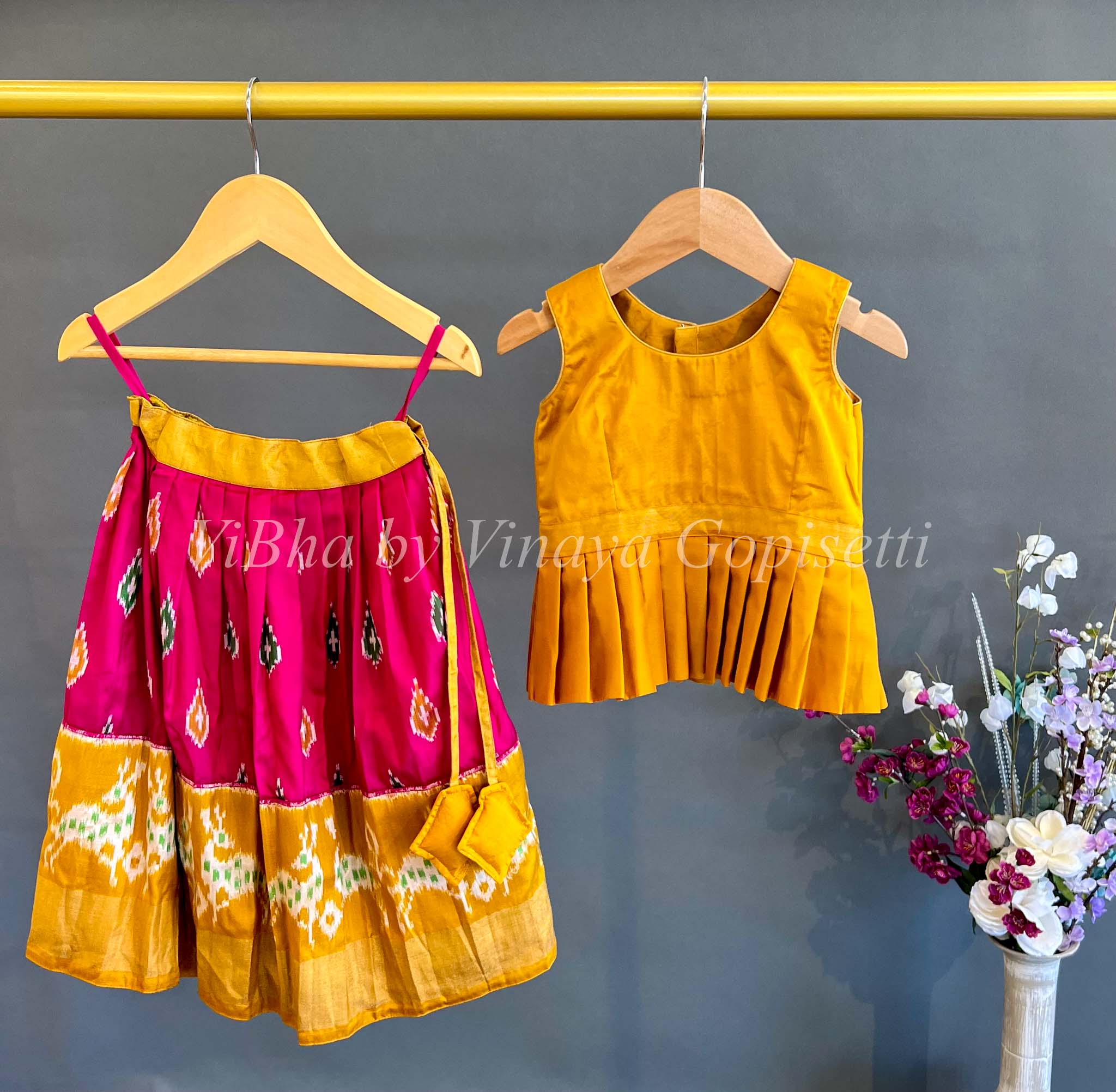 http://www.vibha.us/cdn/shop/products/kids-wear-rani-pink-and-mustard-yellow-ikkat-silk-skirt-and-top-1.jpg?v=1673694272