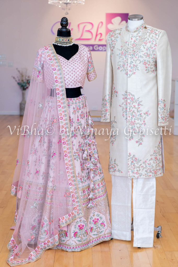 Couple portrait on wedding day with bride in a pink benarasi lehenga and  groom in navy blue sherwani |… | Couple wedding dress, Indian wedding,  Indian wedding gowns