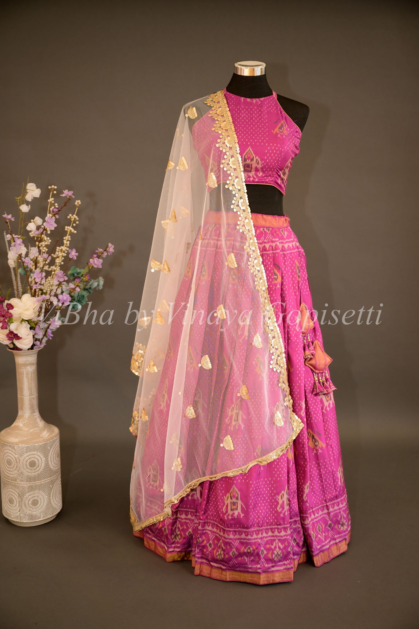 One shoulder hot pink embroidered blouse and ivory lehenga set (E-27/T –  Anju Modi